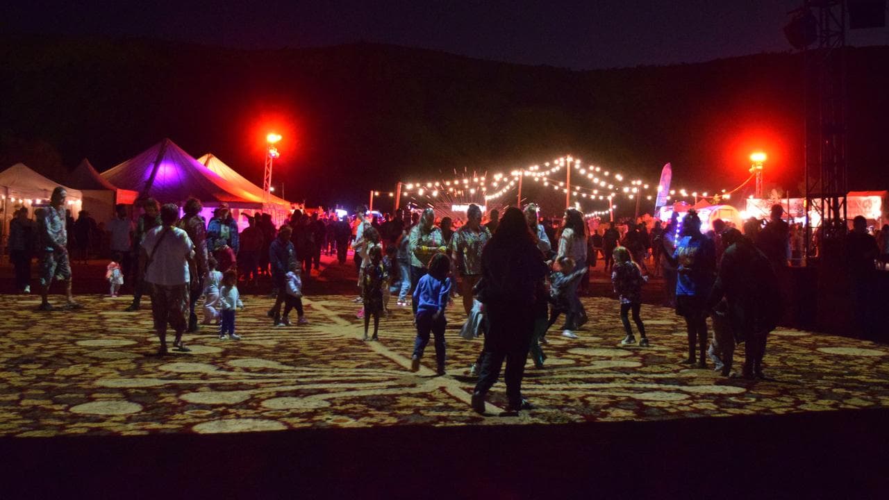 Families explore the 'Grounded' installation at the Parrtjima