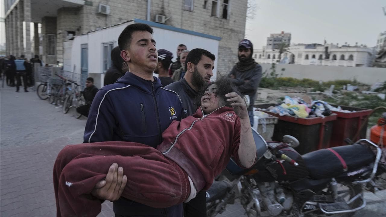 Palestinians who were injured in an Israeli airstrike