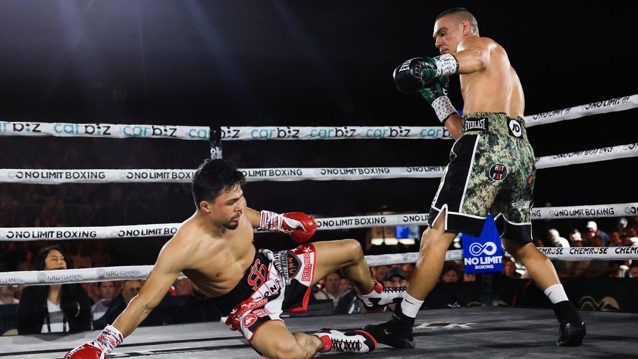 Joey Spencer hits the canvas after a Tim Tszyu onslaught.