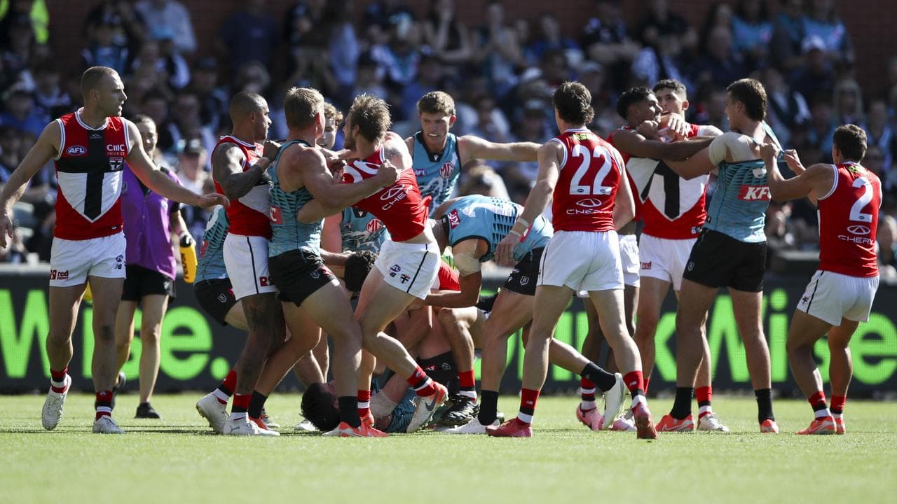 Port Adelaide and St Kilda players fighting.