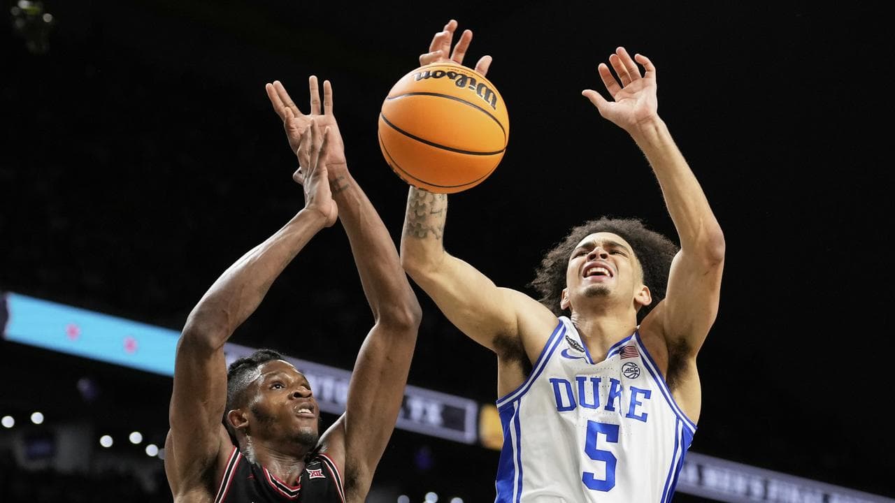 Duke guard Tyrese Proctor (right)