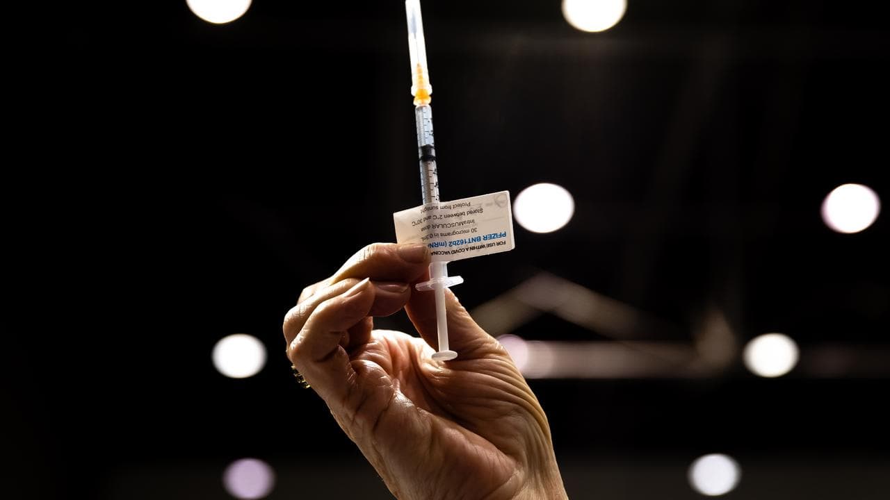 A syringe with a COVID-19 vaccine.