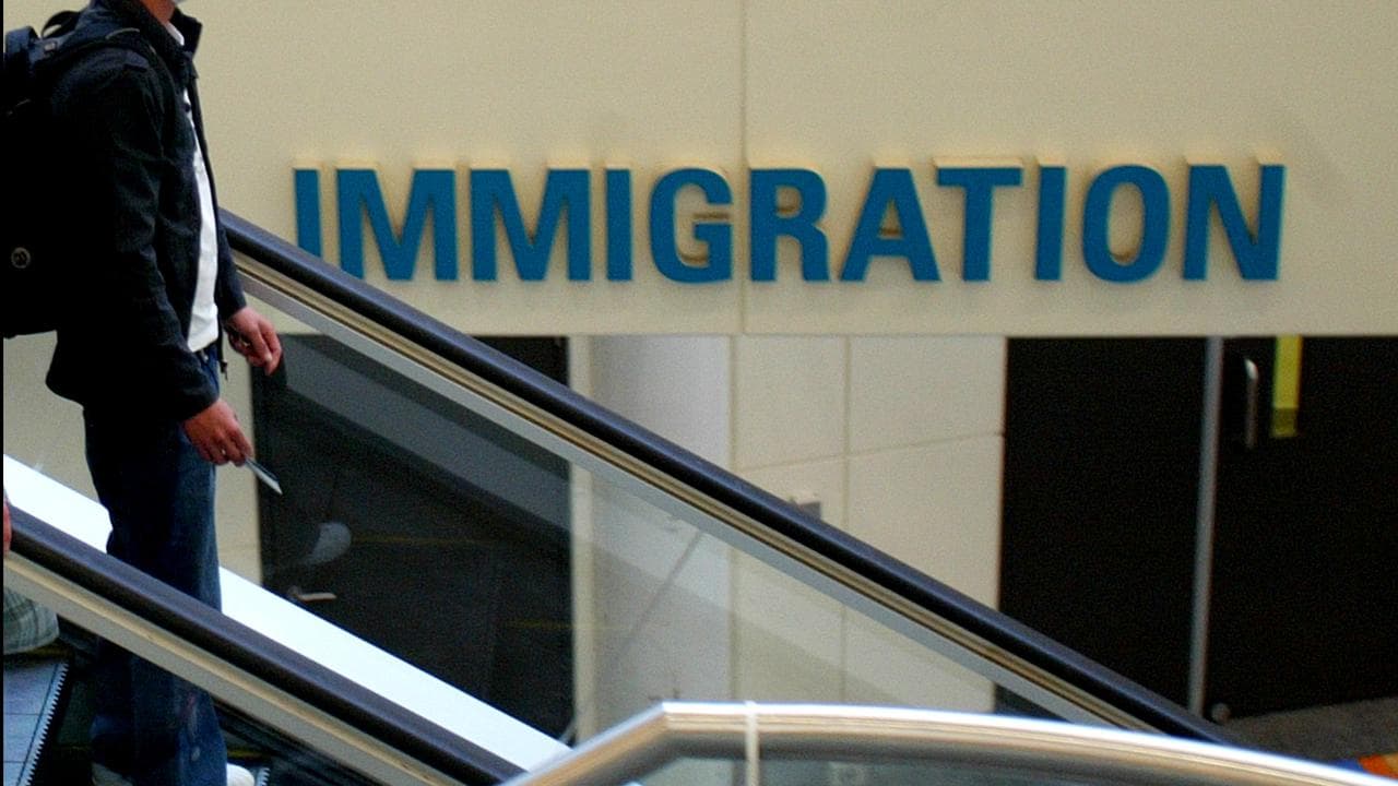 Passenger by Immigration sign at Brisbane International Airport 2009