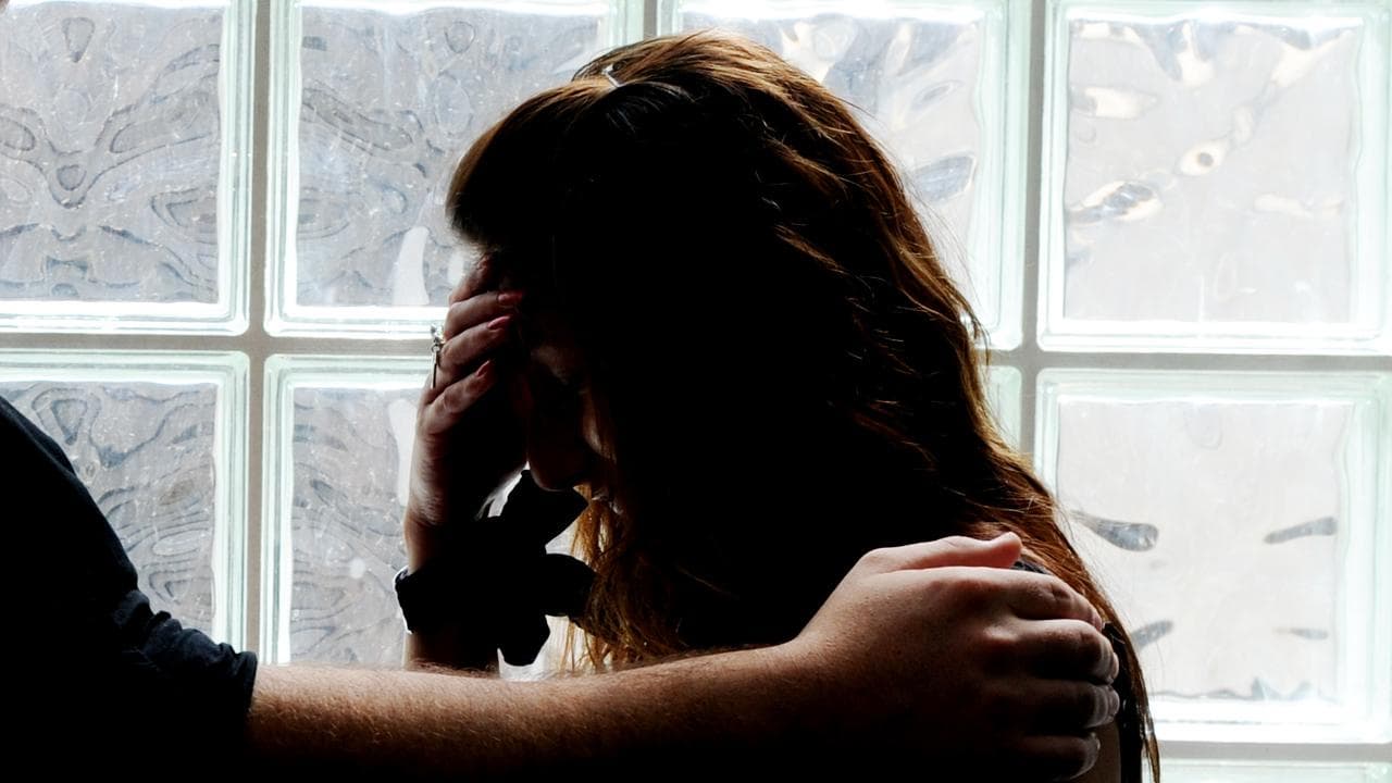 Woman poses for a photograph