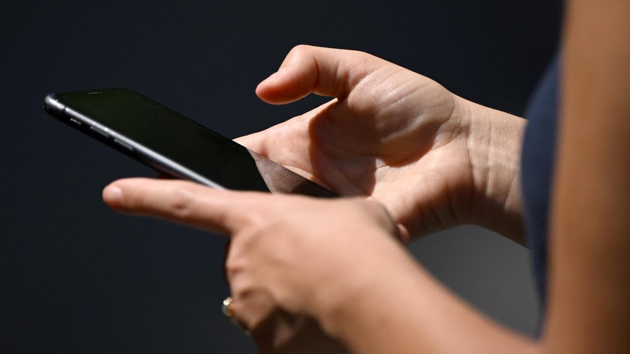 Woman uses smartphone device