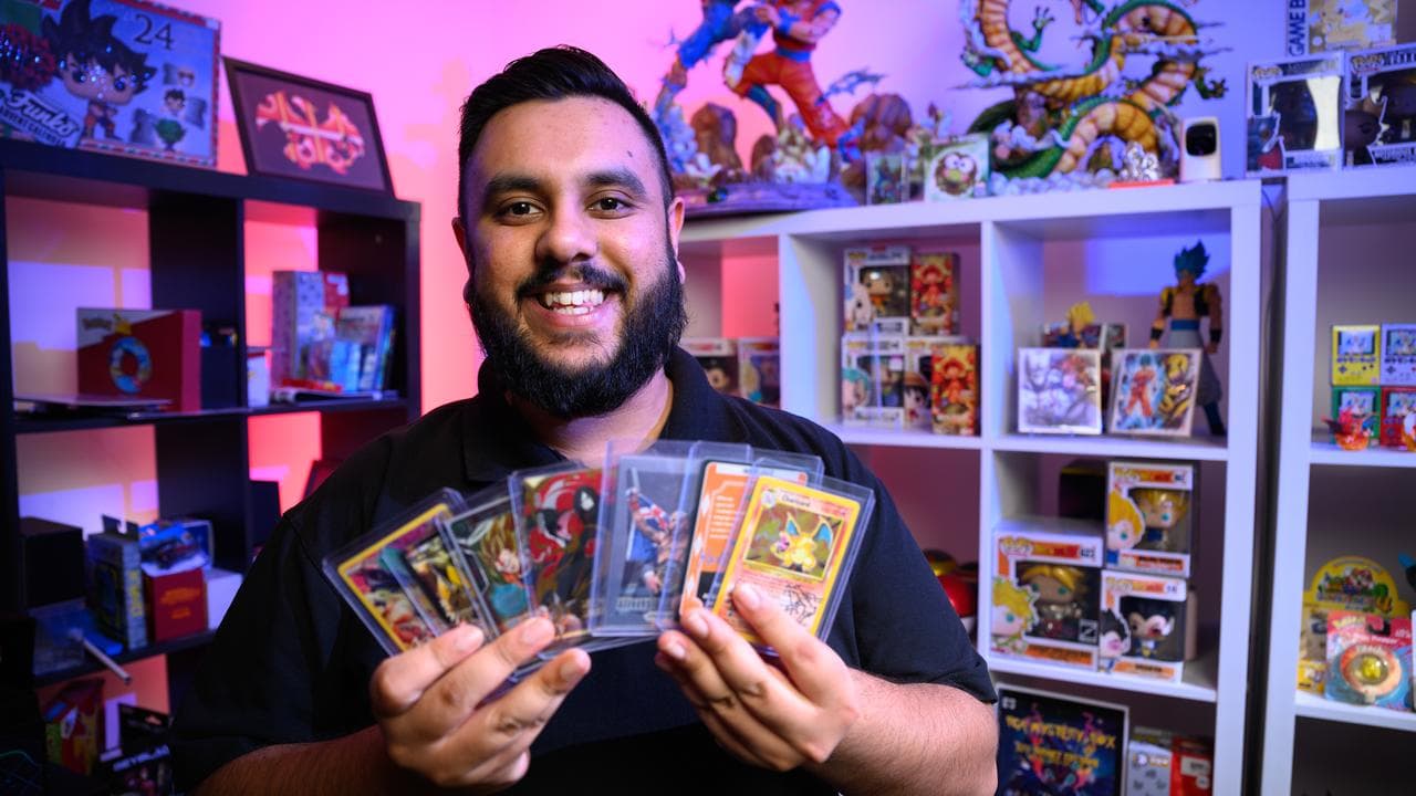 Asif Mir poses for a photograph with his collectables