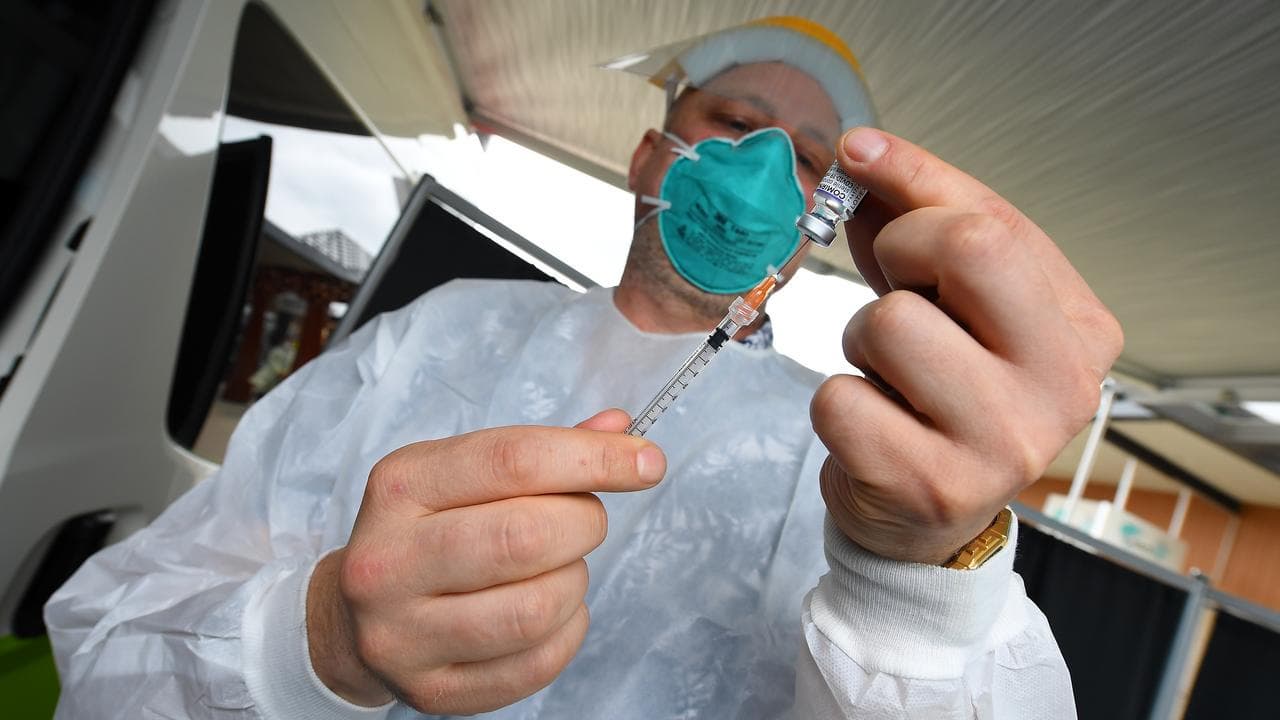 A healthcare worker preps a Covid19 vaccination (file)