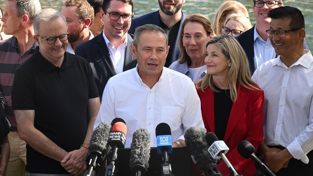 WA Premier Roger Cook (centre).