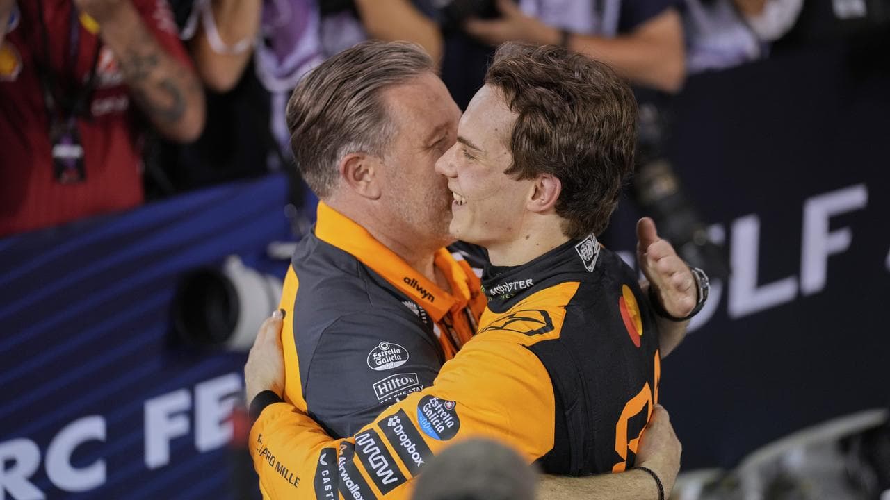 Zak Brown hugs Piastri