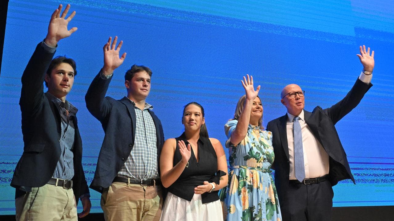 Peter Dutton joined on stage by his family