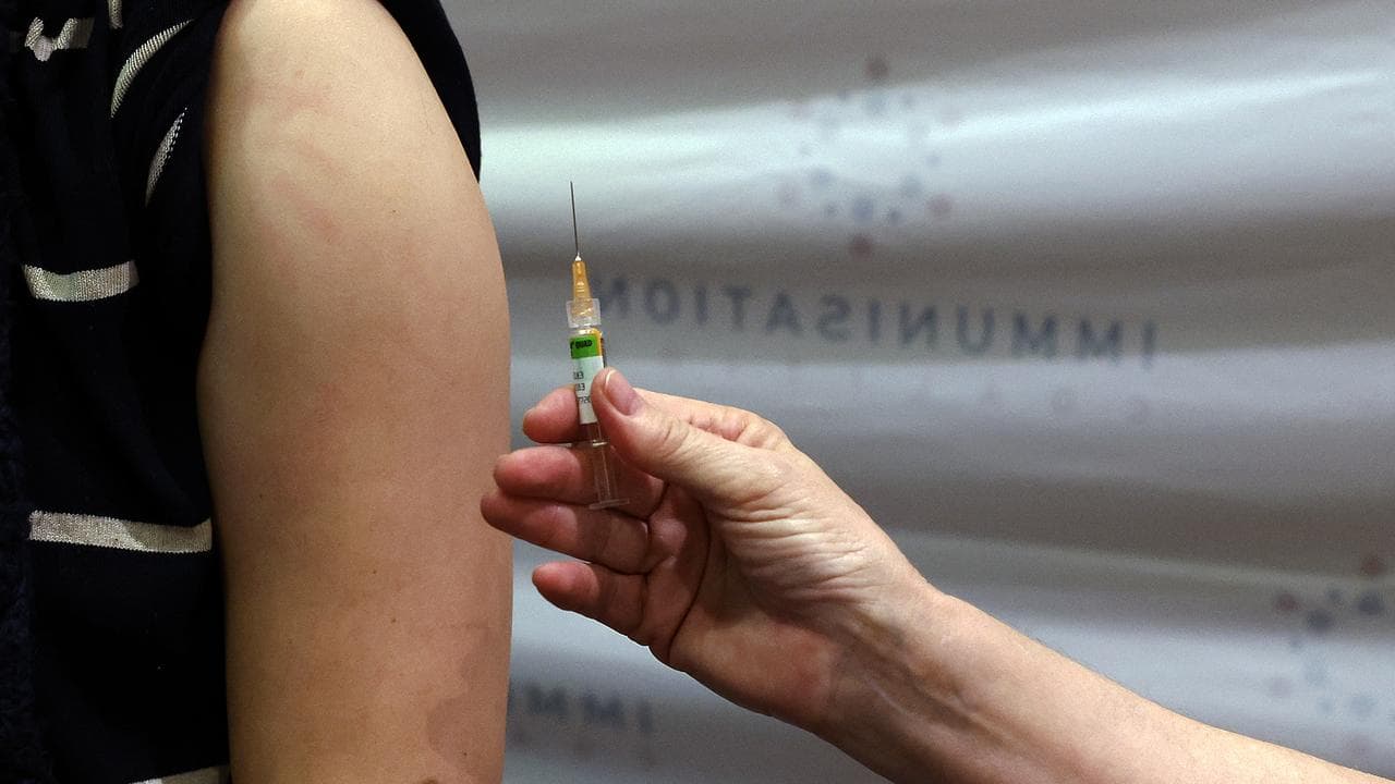 Someone being vaccinated