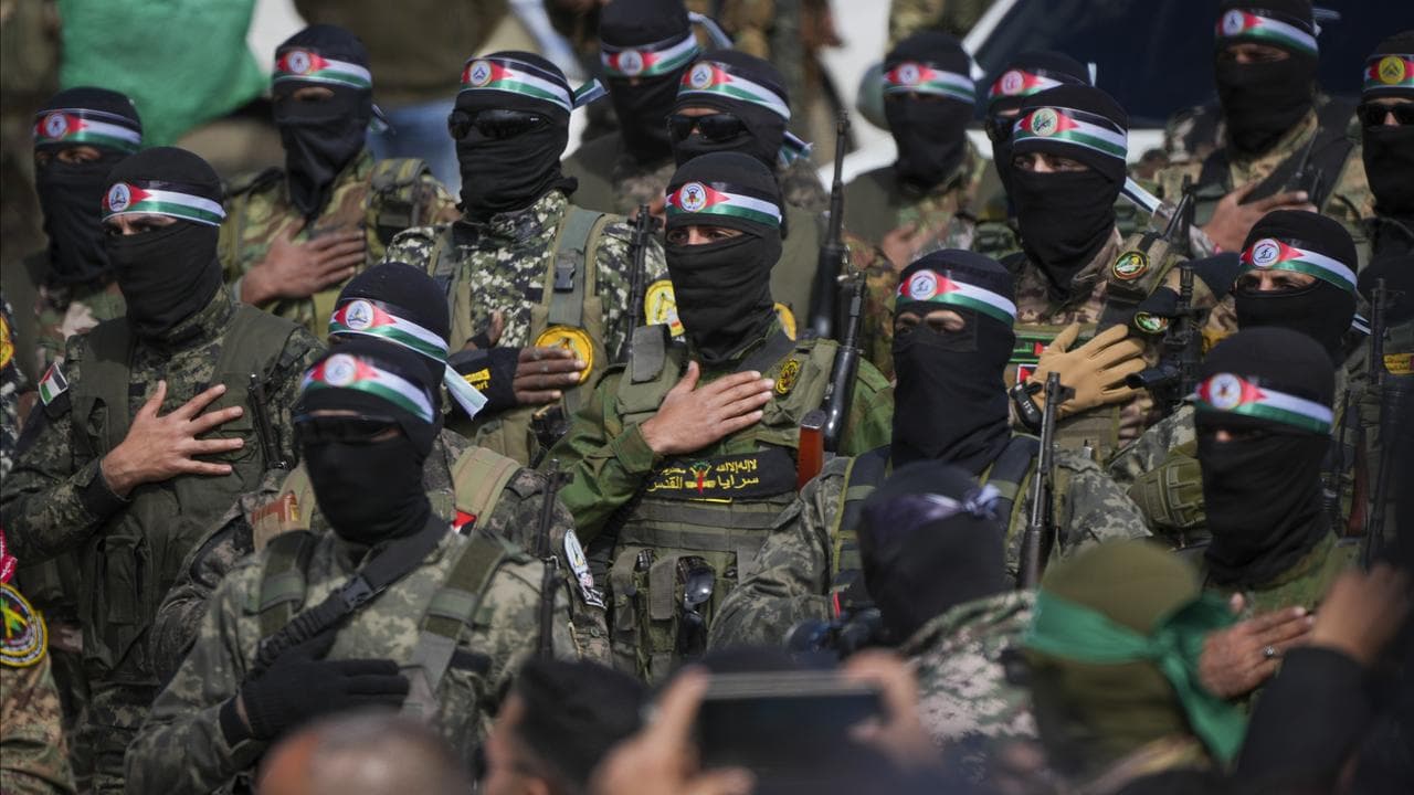 Hamas fighters prepare for the ceremony of Israeli hostages hand over