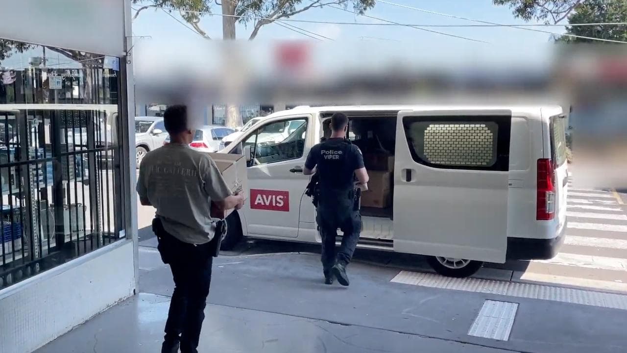Police during raids of tobacco shops in Melbourne