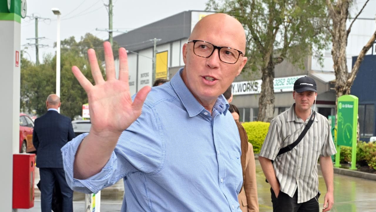 Opposition Leader Peter Dutton waves on the campaign trail