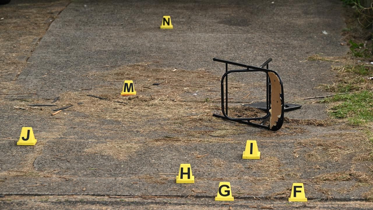 Crime scene markers at a home where a woman was killed.