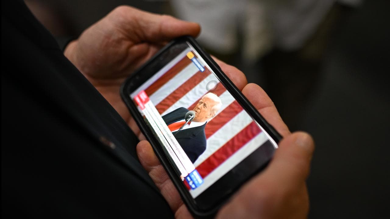 Donald Trump announcement on tariffs on phone screen April 3, 2025