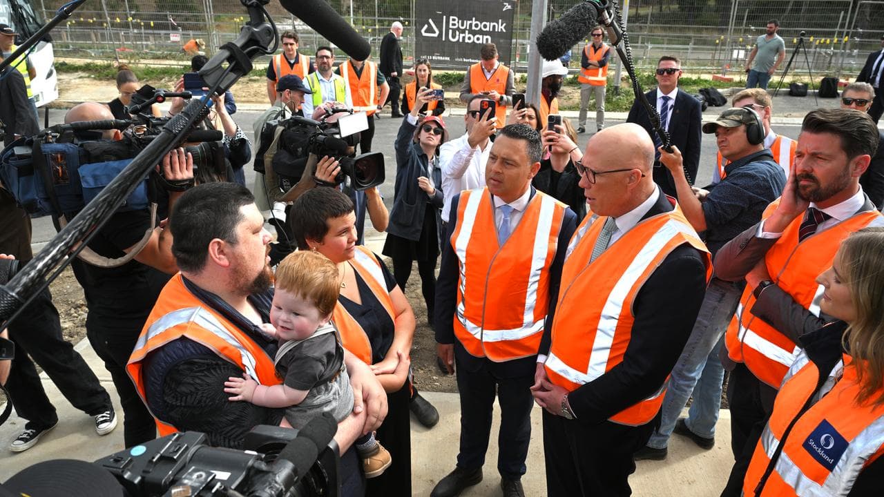Peter Dutton speaks to Corey Wilson-Glenister, Maxie Waaka and son Leo