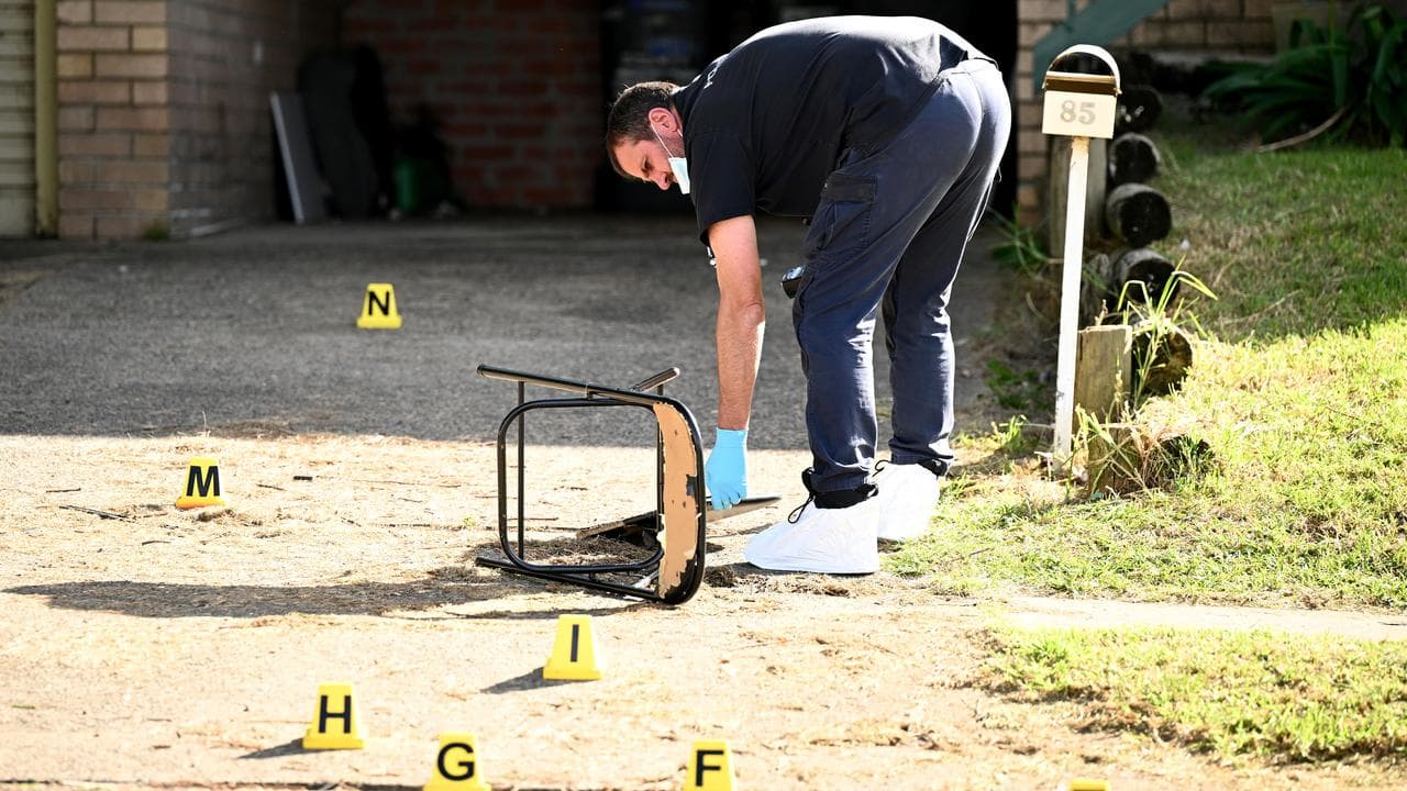 Forensics officers attend the scene of a fatal shooting (file image)