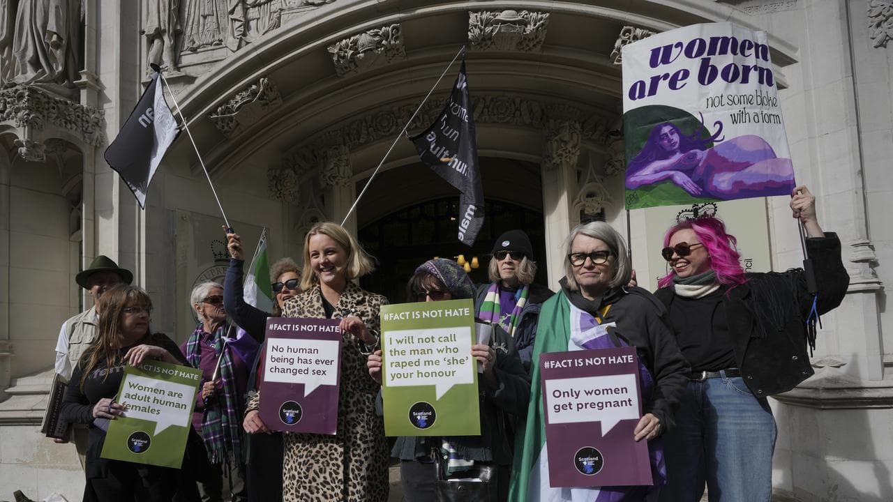 Women's rights activists celebrate outside court in London