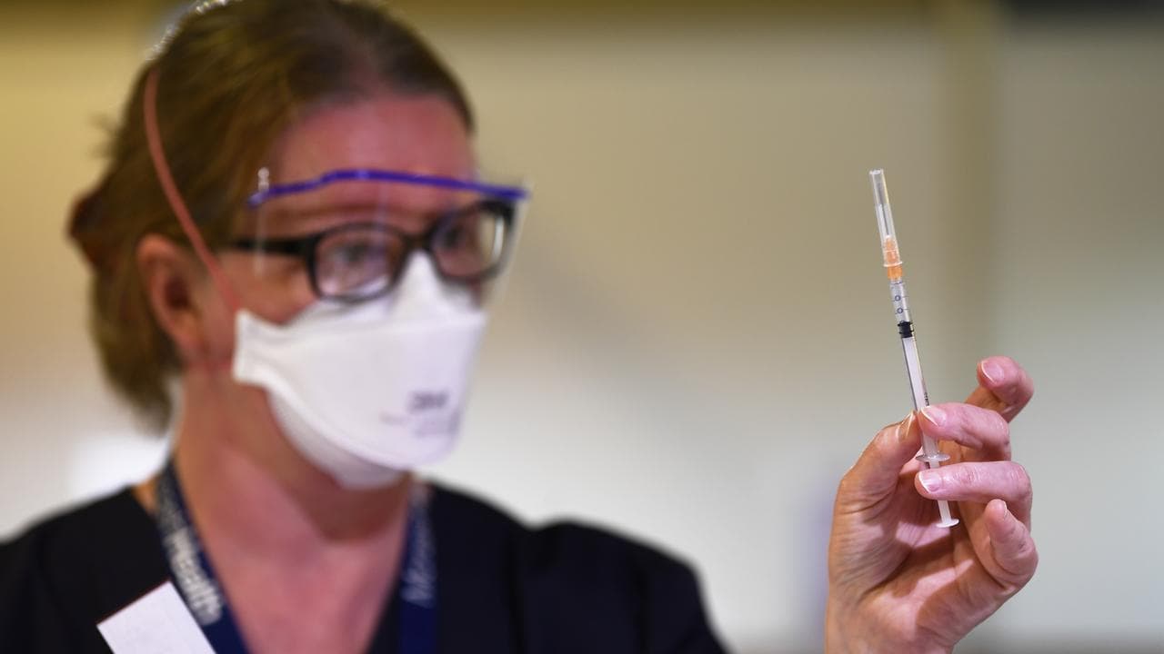 A healthcare worker preparing a covid shot in Melbourne.
