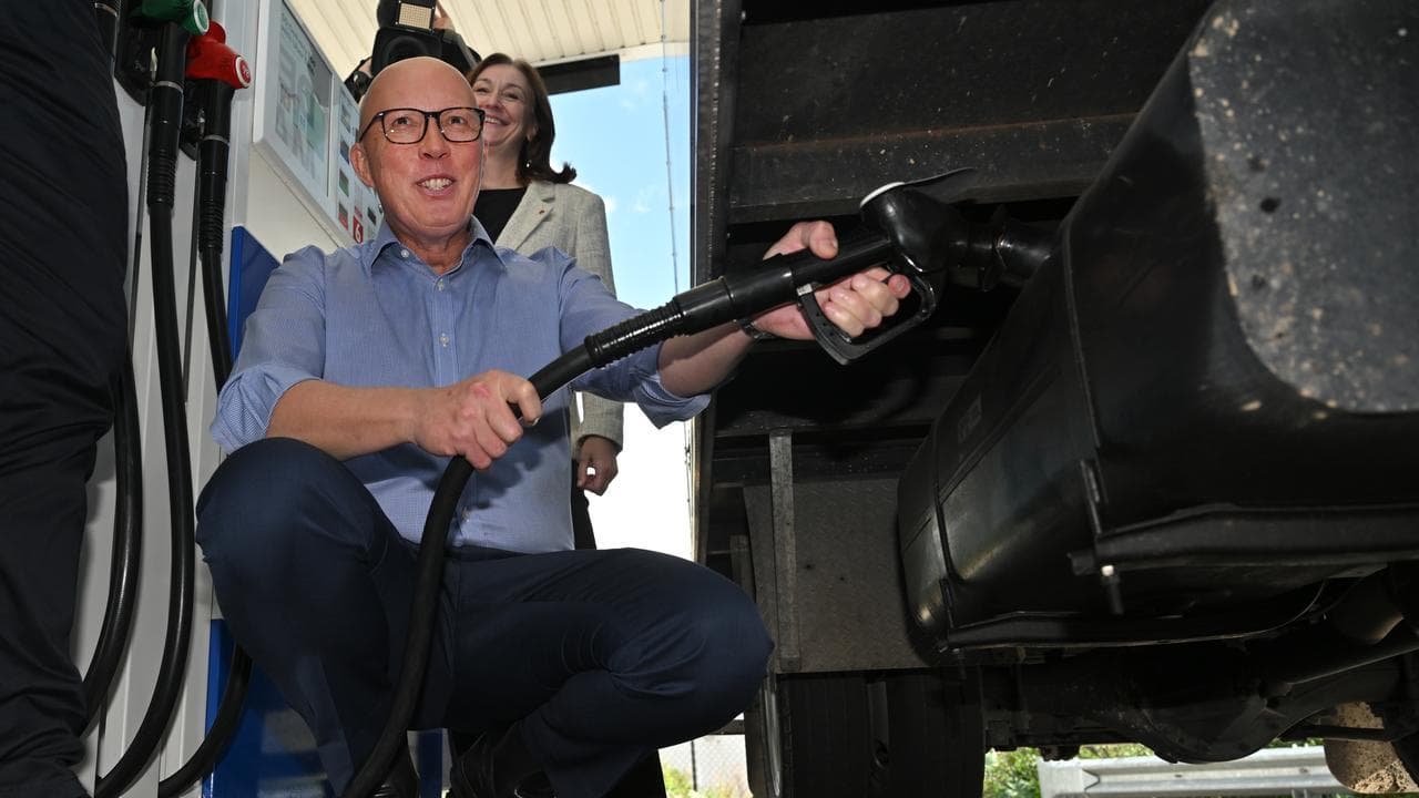 Peter Dutton at a petrol station
