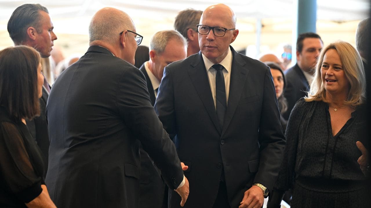 Peter Dutton greets former prime minister Scott Morrison