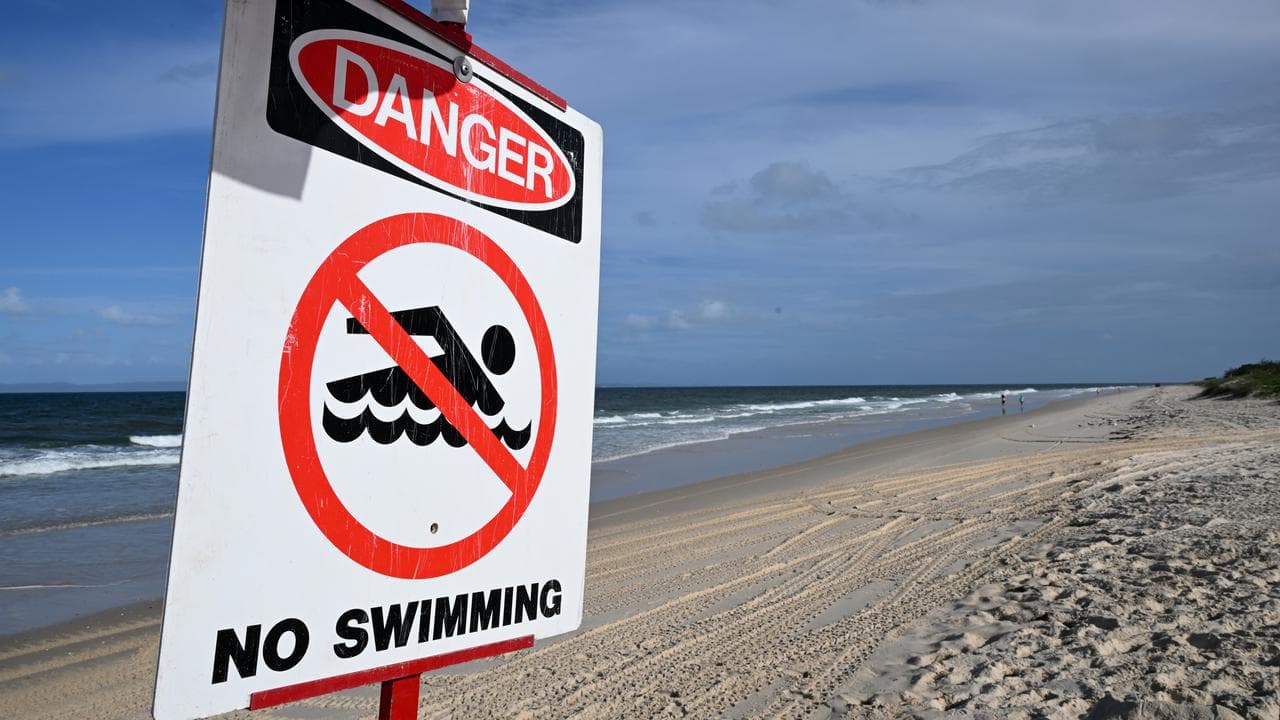 A sign warning against swimming i