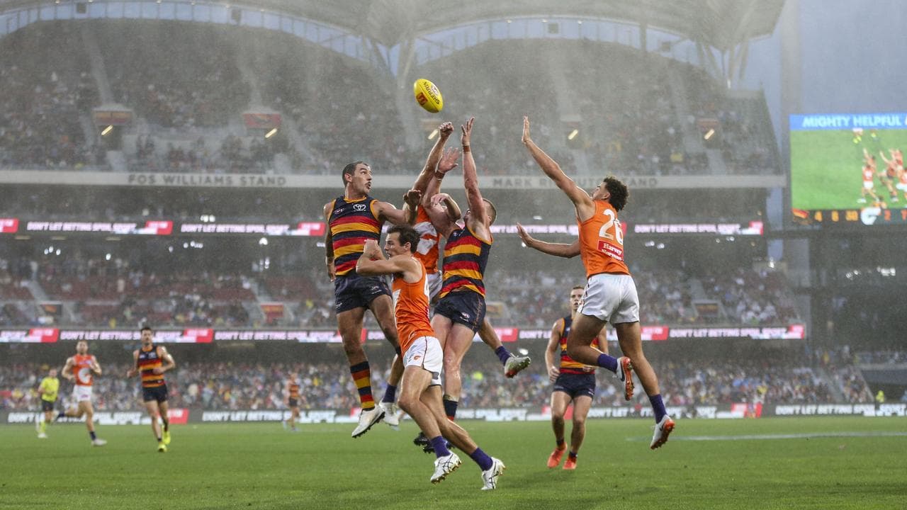 Adelaide's Taylor Walker (left)