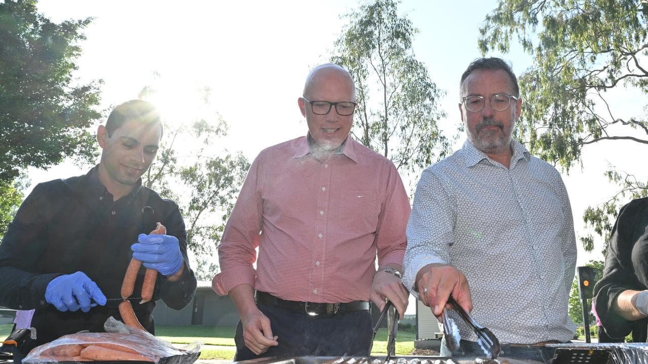 Opposition leader Peter Dutton cooks a barbecue