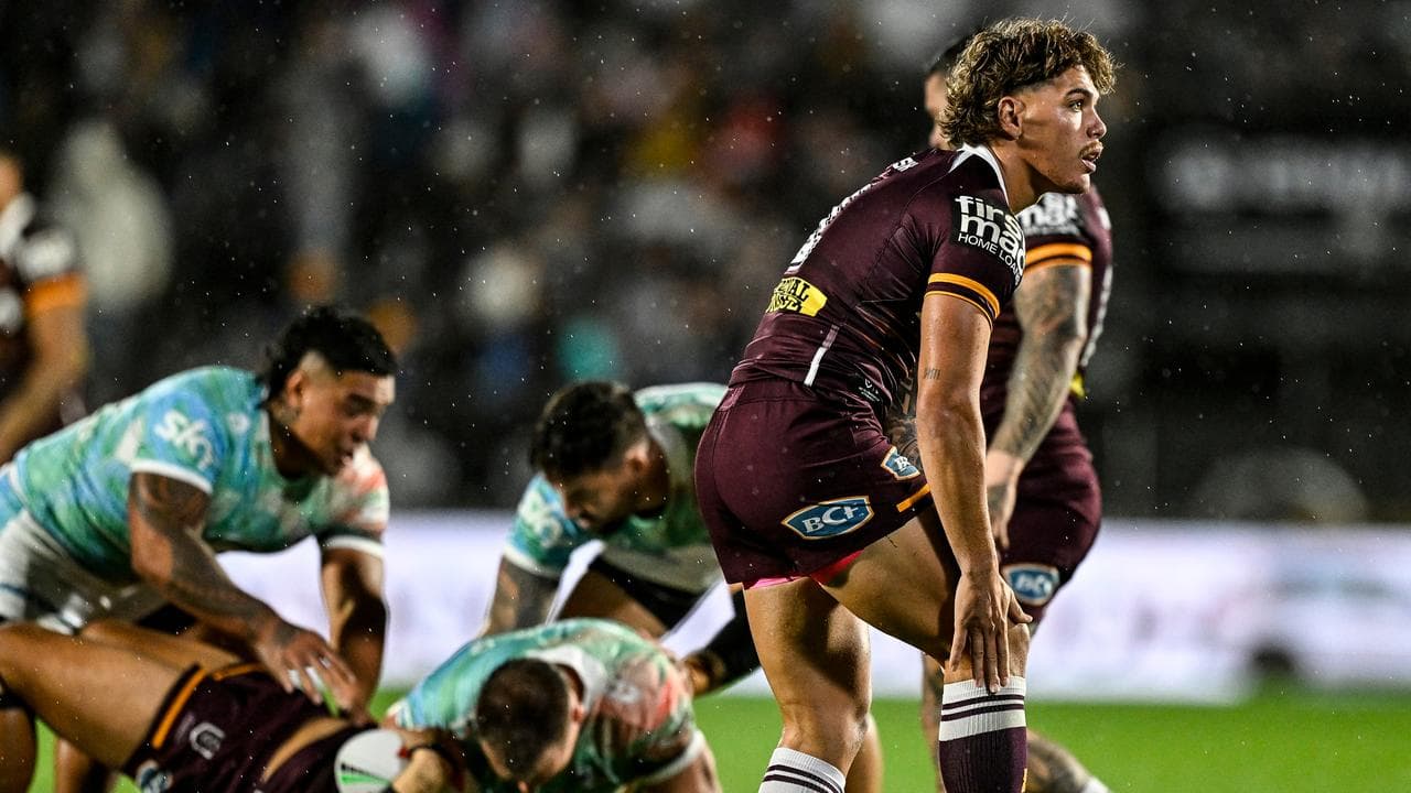 Reece Walsh of the Broncos clutches