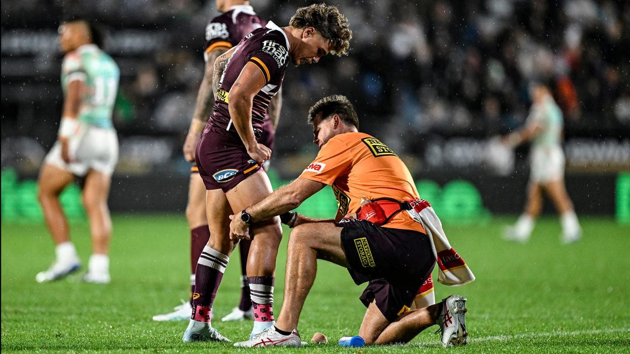 Reece Walsh of the Broncos receives 