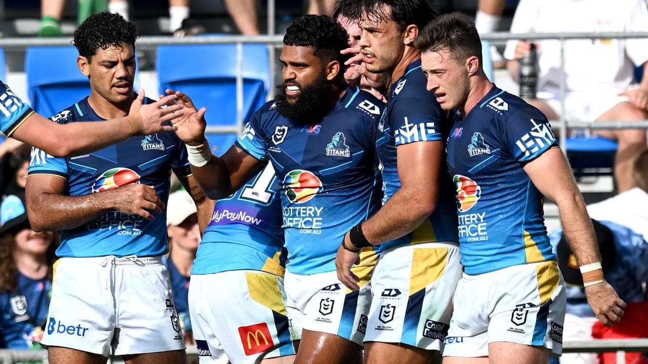 Gold Coast teammates rush to Allan Fitzgibbon