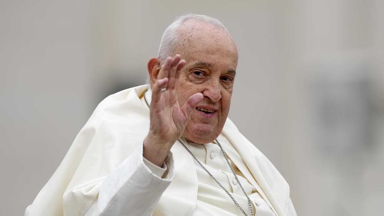 Pope Francis smiles after celebrating Easter mass