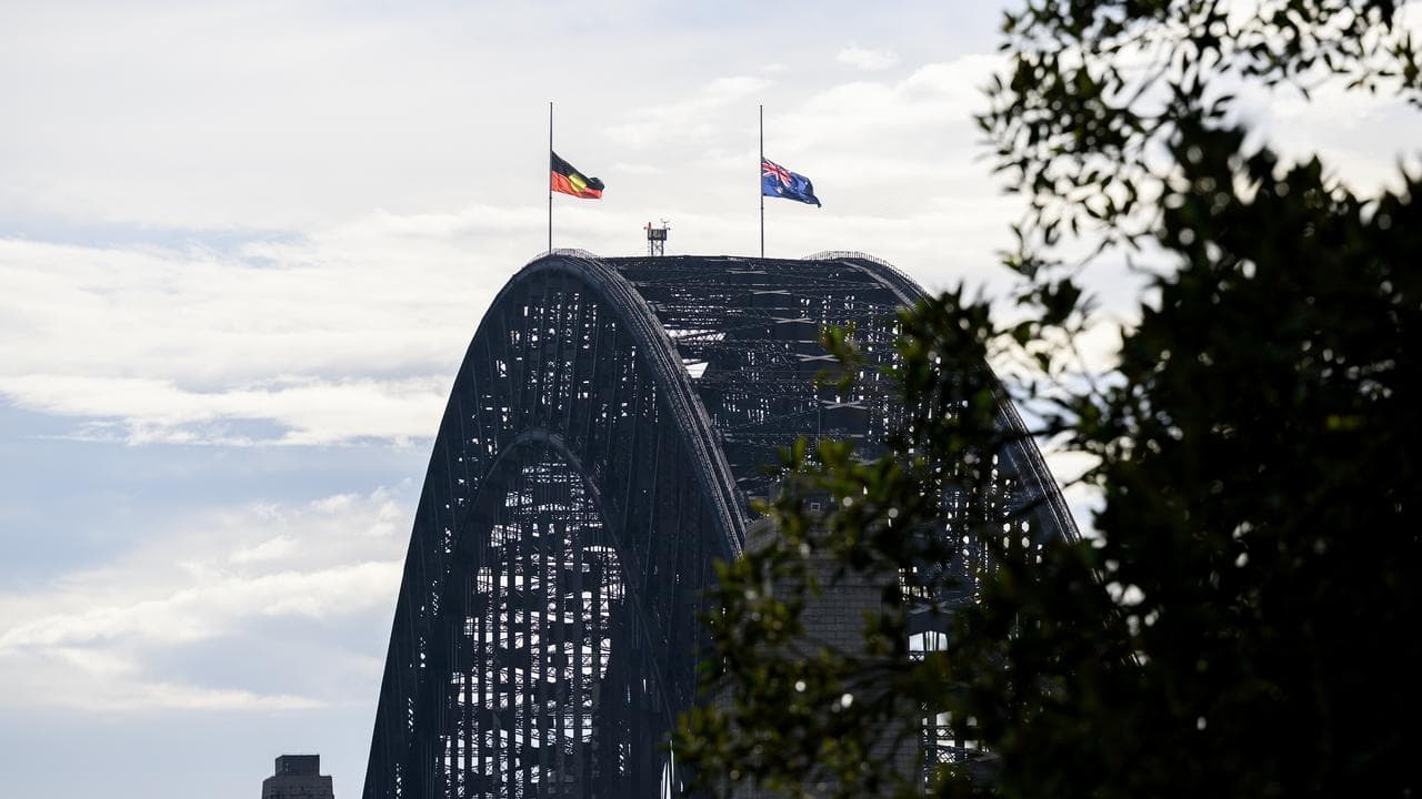 Flags at half mast atop Sydney Harbour Bridge