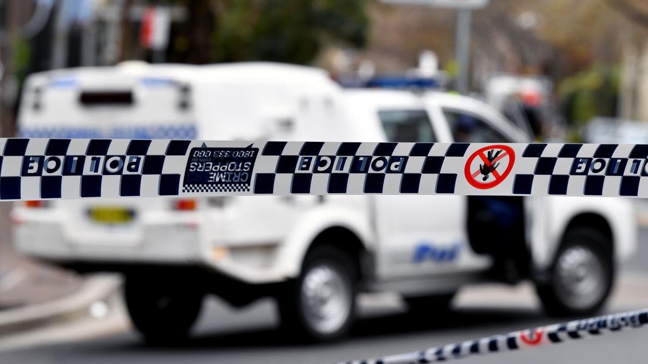 Police tape restricts access to a street (file image)