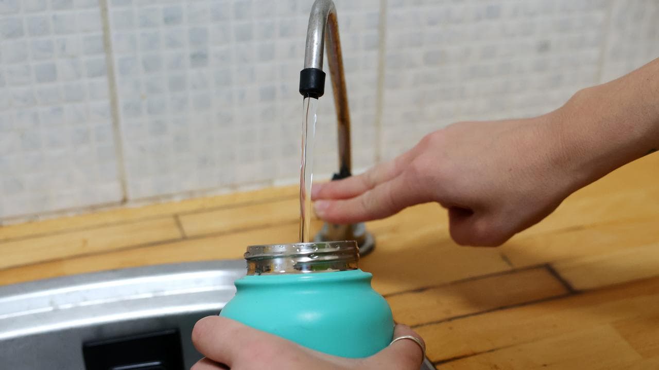 A water bottle is filled with tap water