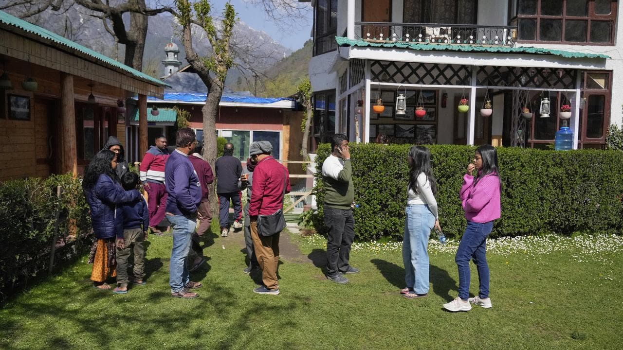 Tourists after militants opened fire near Pahalgam in Indian Kashmir