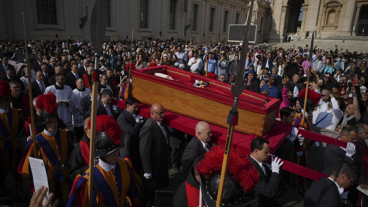 The body of Pope Francis is carried into St Peter's Basilica