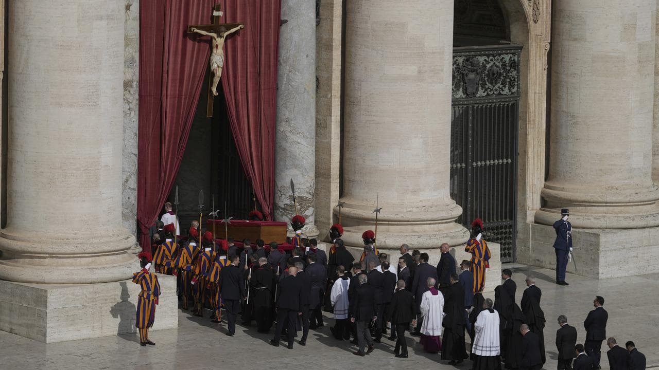 The body of Pope Francis is carried through St. Peter's Square