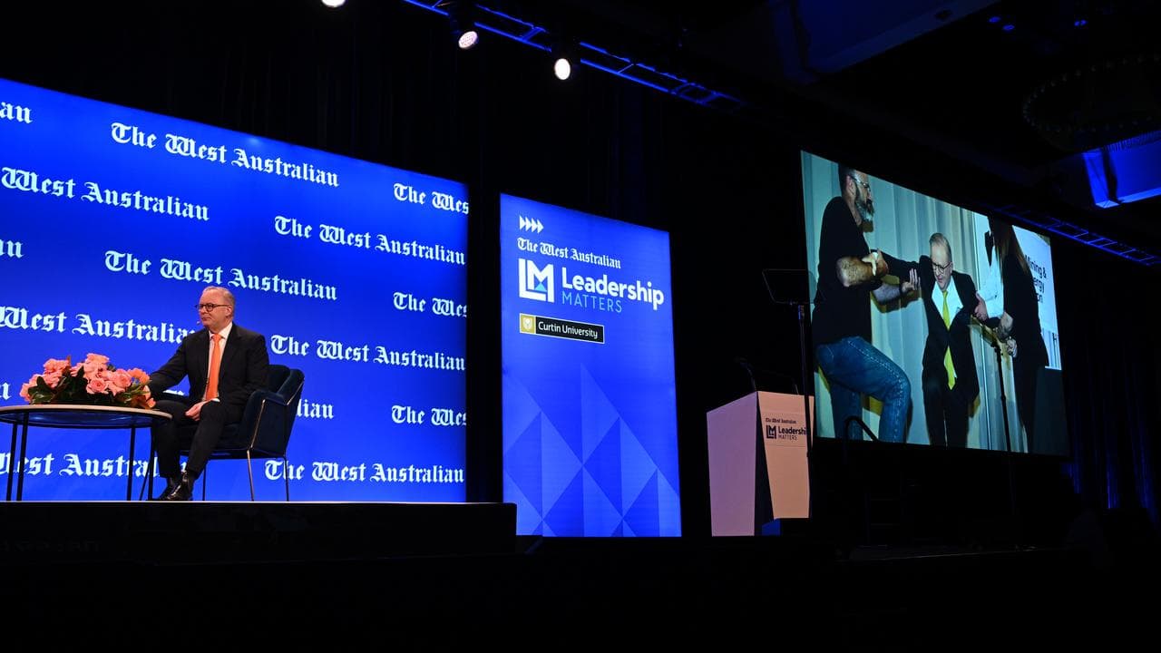 An image of Anthony Albanese falling off a stage