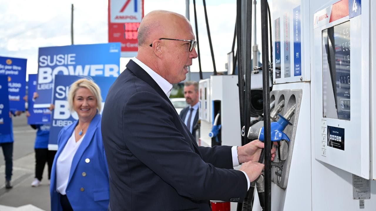 Peter Dutton at a petrol station