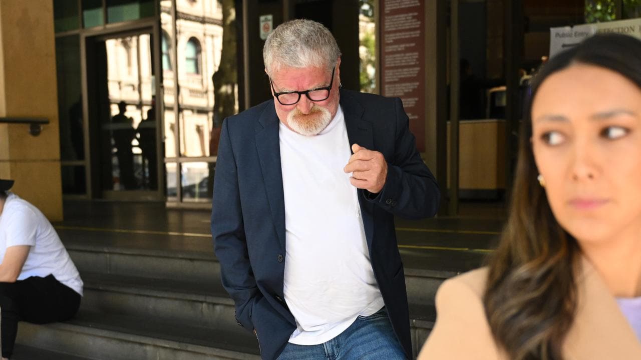 Michael Martin (centre) departs from the Melbourne Magistrates Court