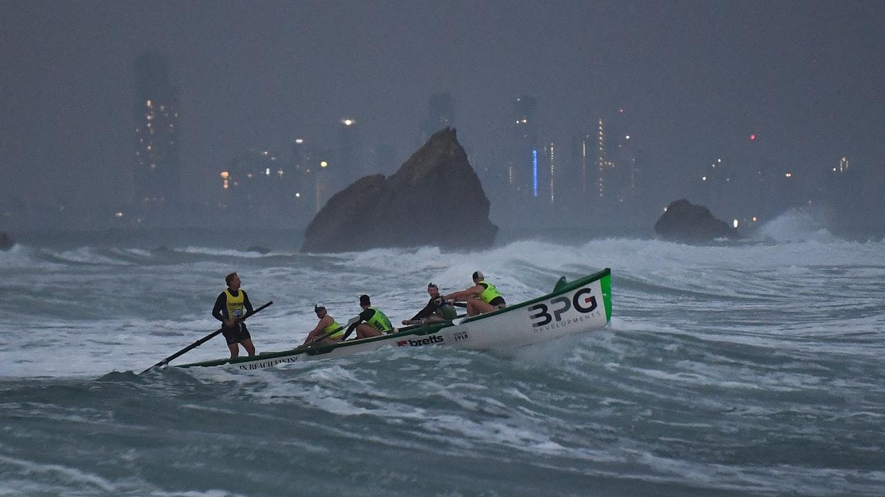 Surf boats perform a burial at sea