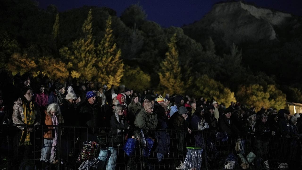 People at the dawn memorial service at the Anzac Cove beach