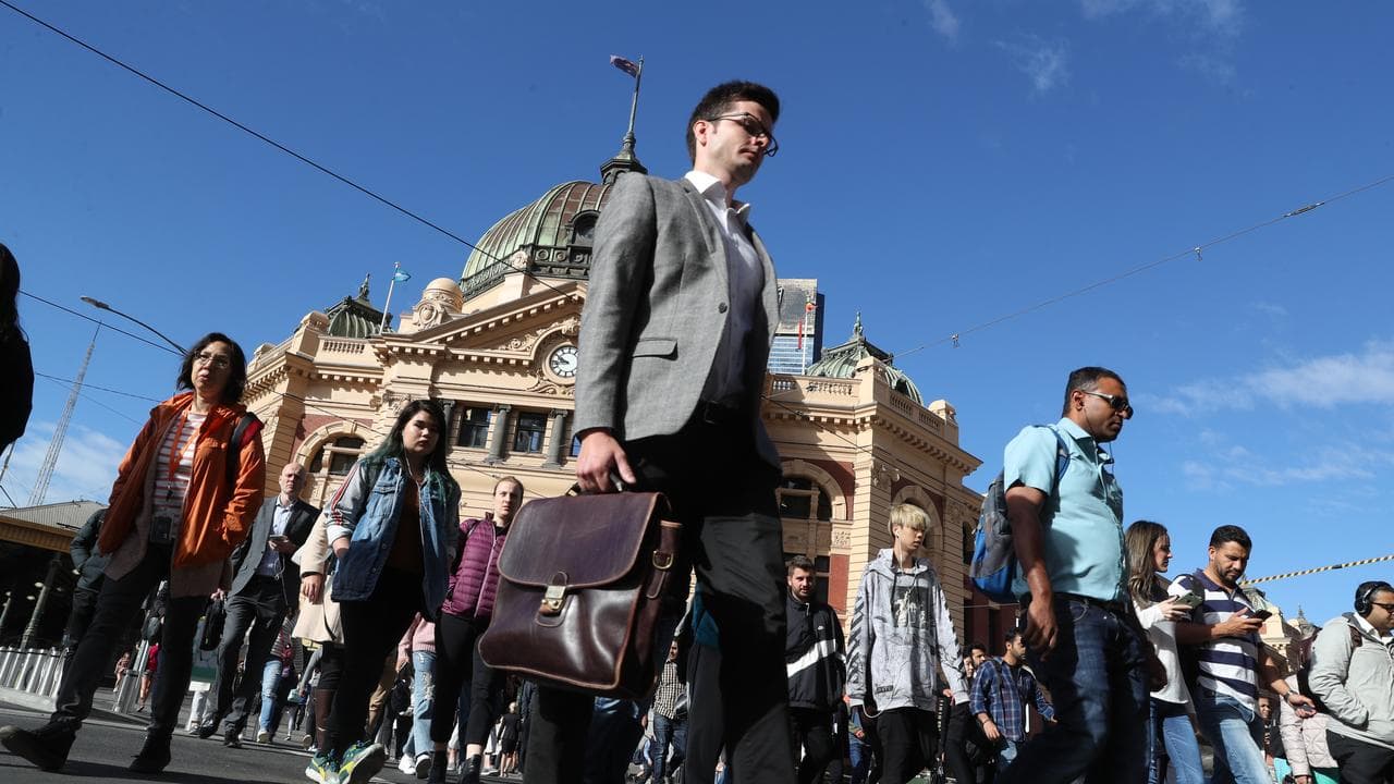 Pedestrians in front of Flinders Street Station, Melbourne, March 2019