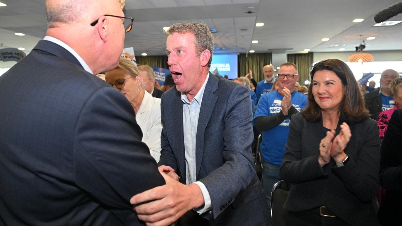 Opposition leader Peter Dutton being greeted by coalition MP Dan Tehan