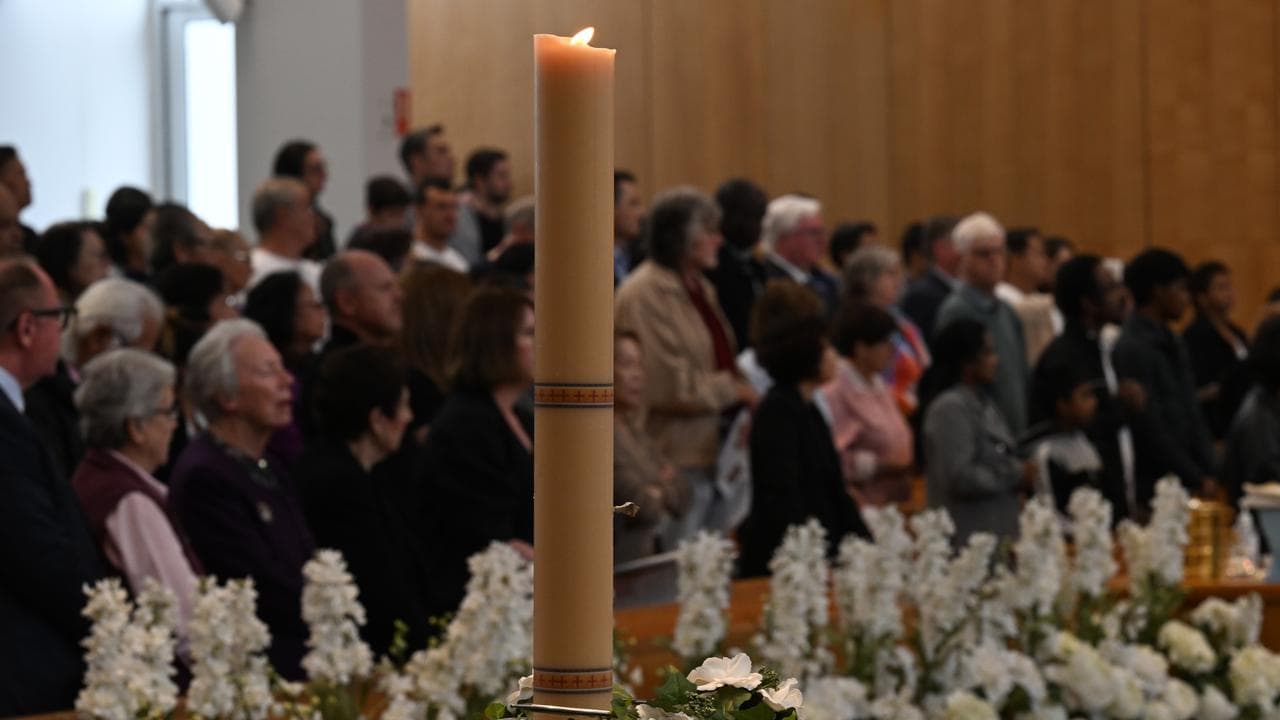 Parishioners attend a solemn mass for the Pope