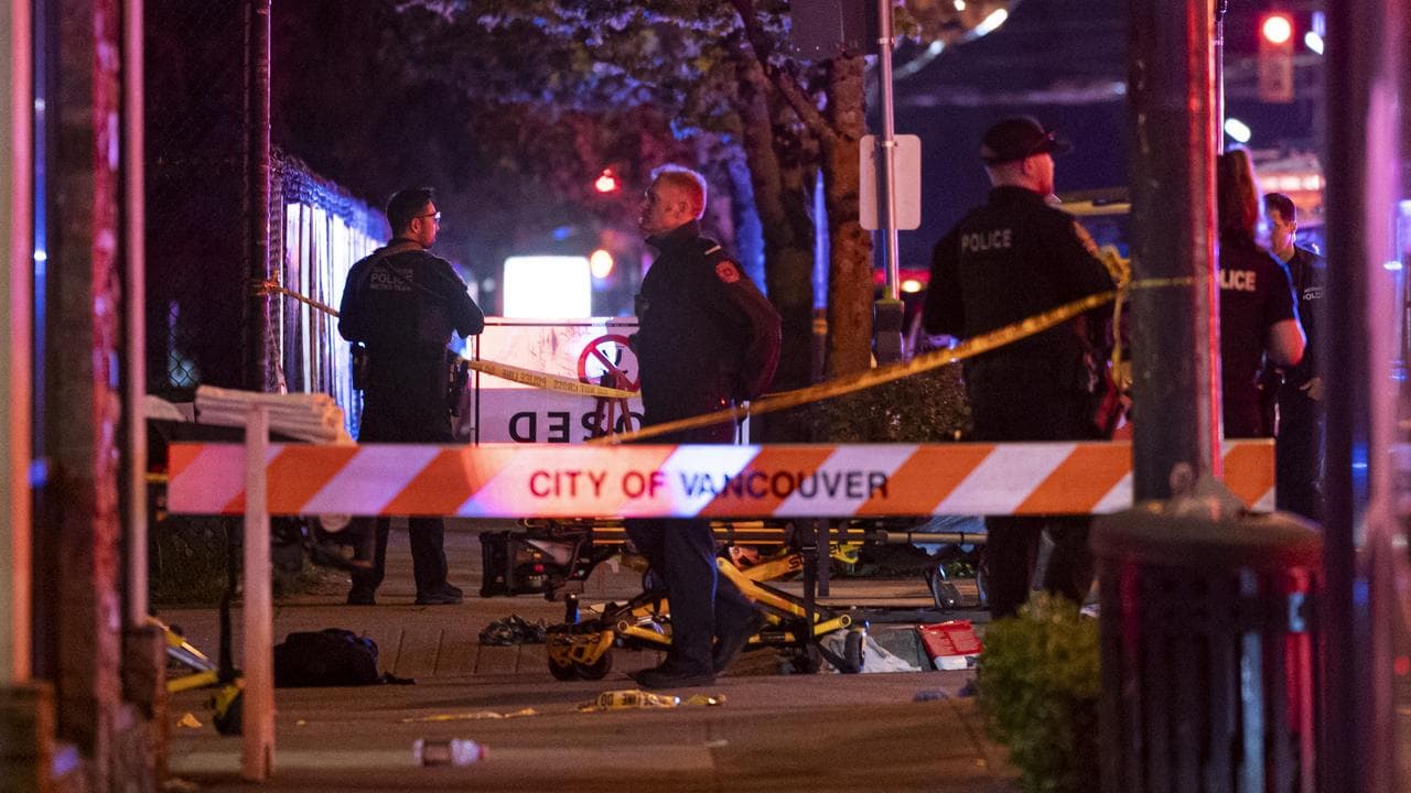 Vancouver police secure the scene after a car drove into a crowd