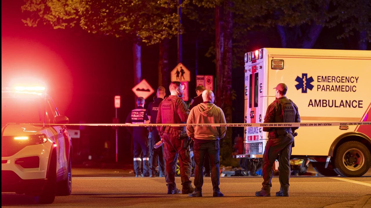 Vancouver police secure the scene after a car drove into a crowd