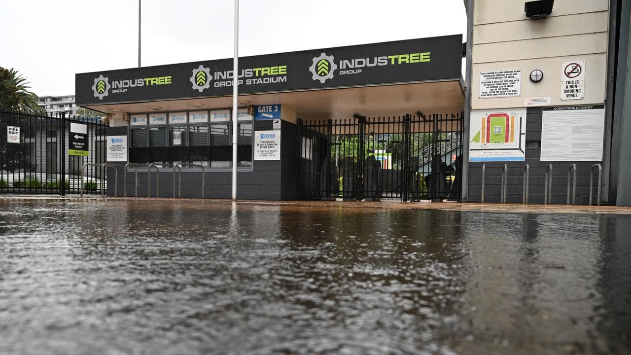 The flooded entry gates at Industree Group Stadium.